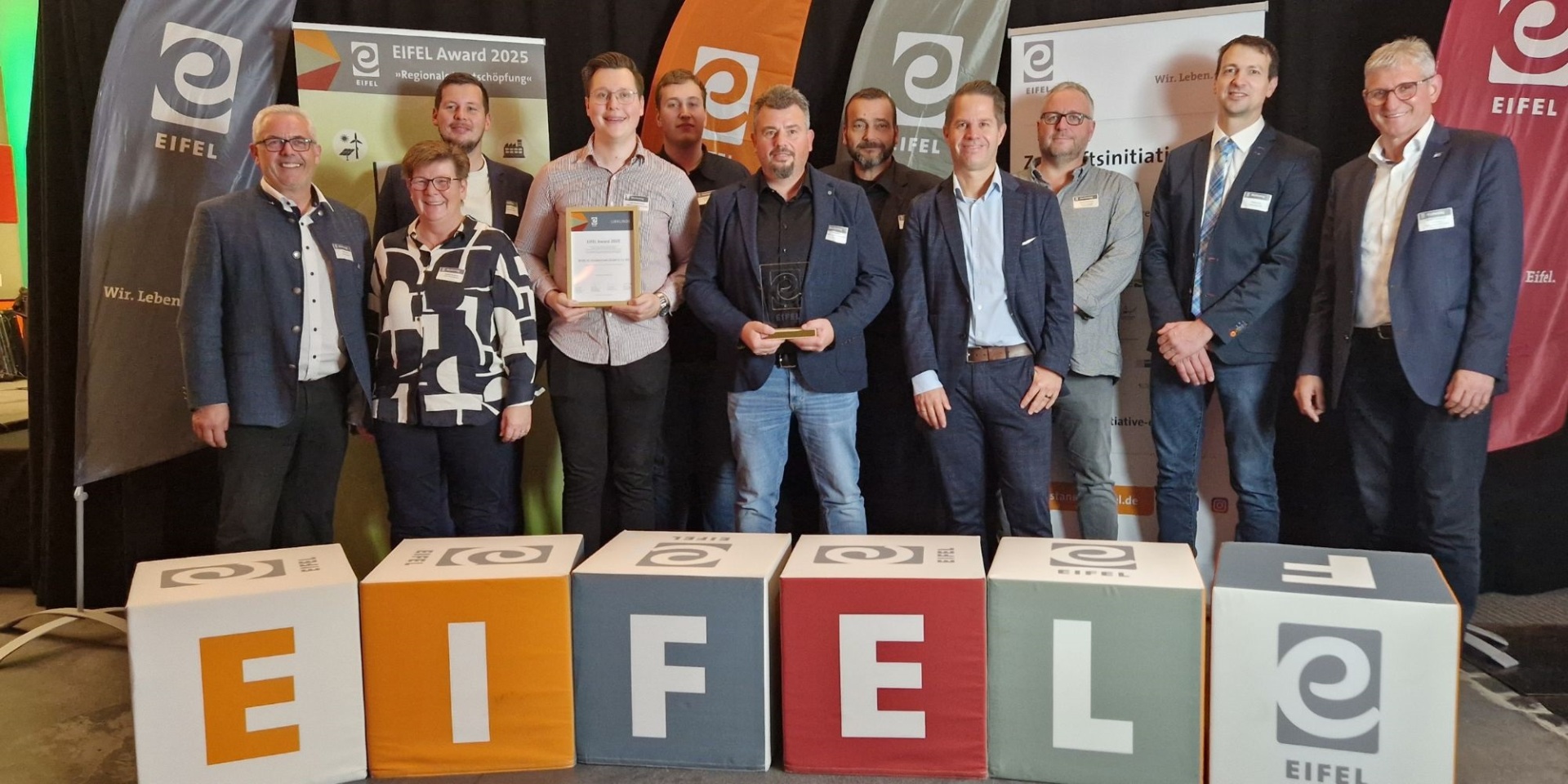 Gruppenfoto der Partner des REWE-Center Jürgen Hundertmark GmbH & Co. KG aus Kaisersesch.